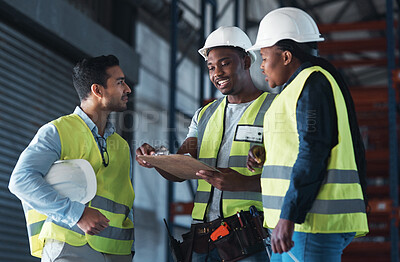 Buy stock photo Shot of a group of contractors standing in the warehouse together and having a discussion