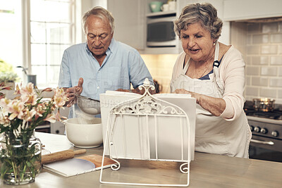 Buy stock photo Shot of a senior couple baking together at home