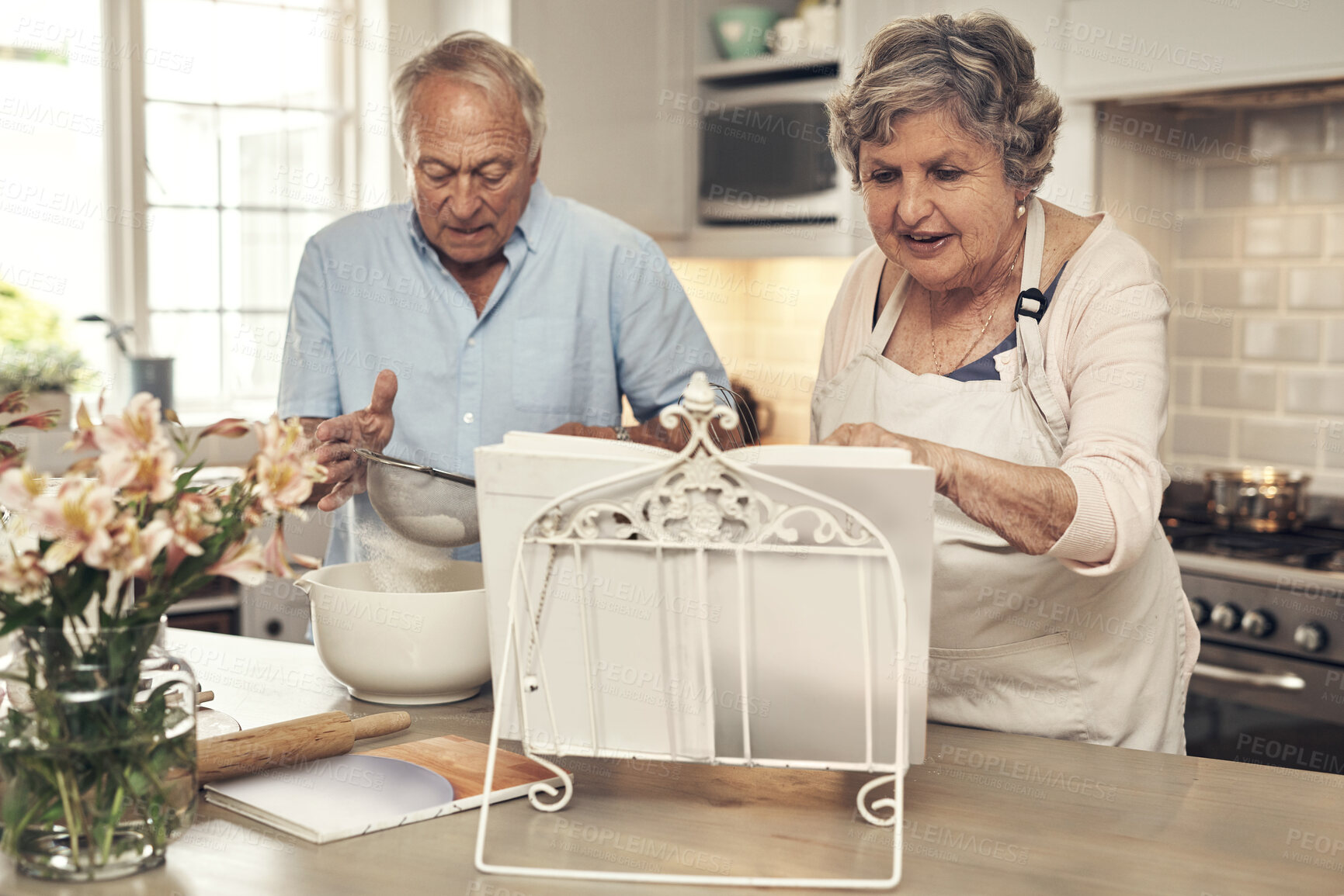 Buy stock photo Shot of a senior couple baking together at home