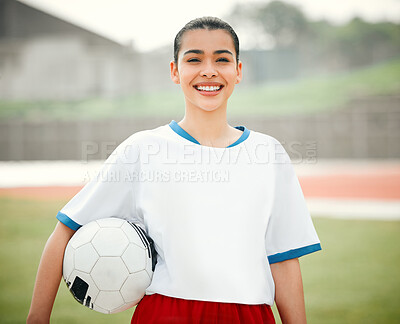 Buy stock photo Cropped portrait of an attractive young female footballer standing outside with a soccer ball in hand