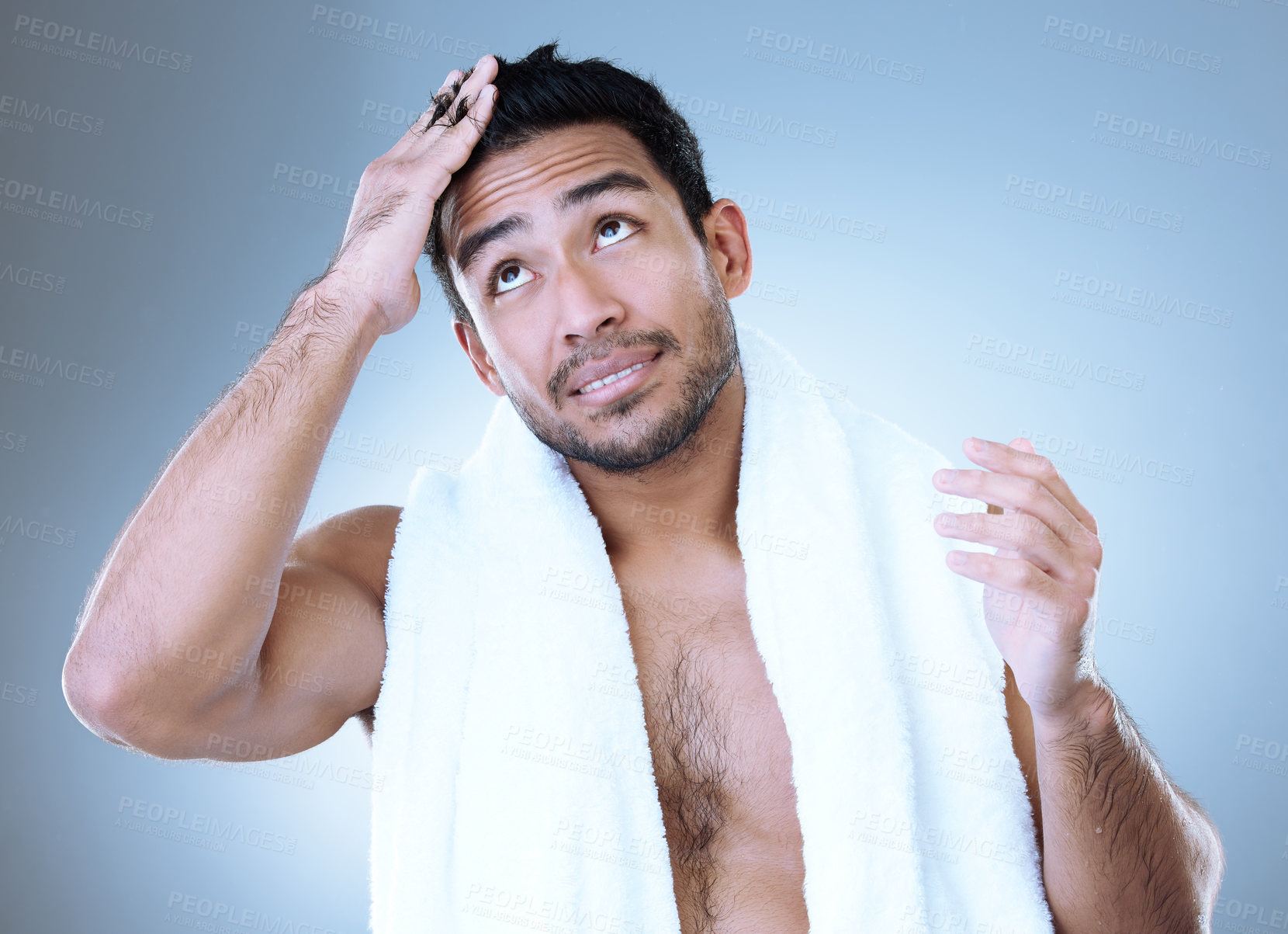 Buy stock photo Man, thinking and haircare with towel for hygiene, skincare and grooming in blue background. Male person, clean and healthy for wellness, confidence and cosmetic with happiness in studio backdrop