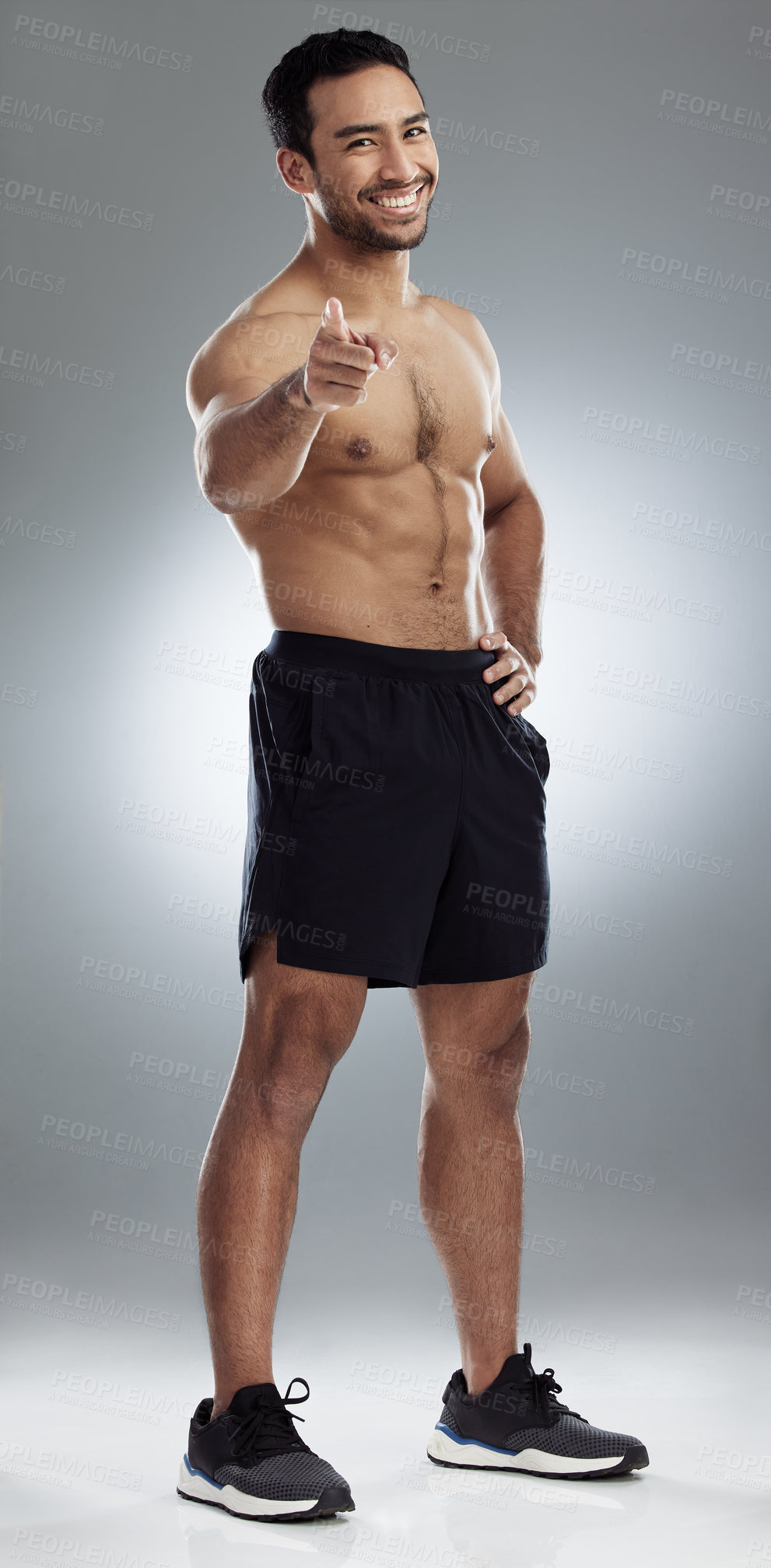 Buy stock photo Shot of a handsome young man against a studio background