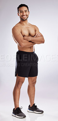 Buy stock photo Shot of a handsome young man against a studio background