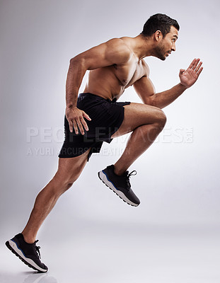 Buy stock photo Man, running and body in studio for workout, speed and fitness on white background with exercise. Athlete, race and training for sports, competition and performance as runner with health or wellness