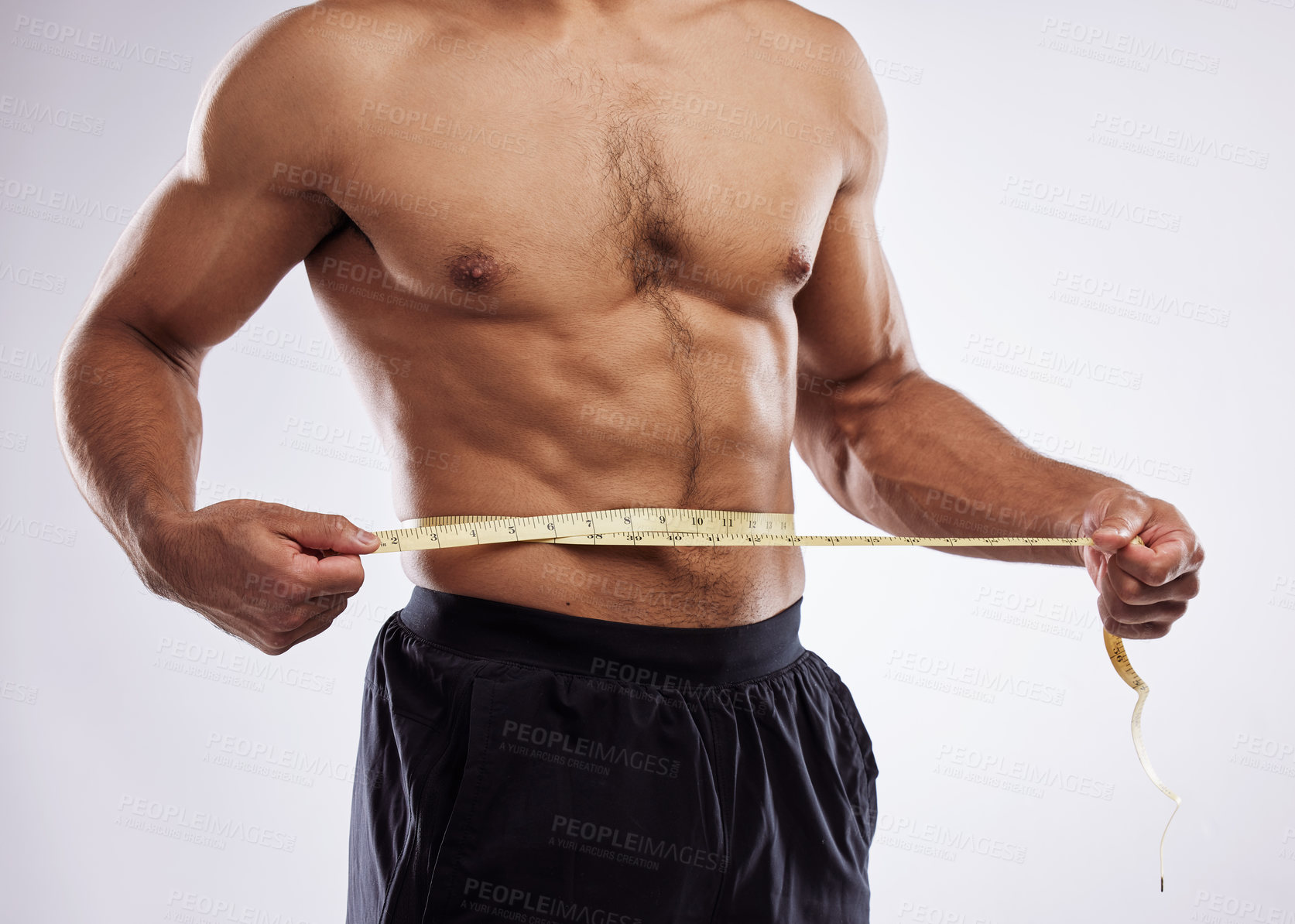 Buy stock photo Fitness, man and measuring tape in studio white background for progress check, weight loss or body care. Male person, diet or fat tracking for wellness, health nutrition or exercise and workout 