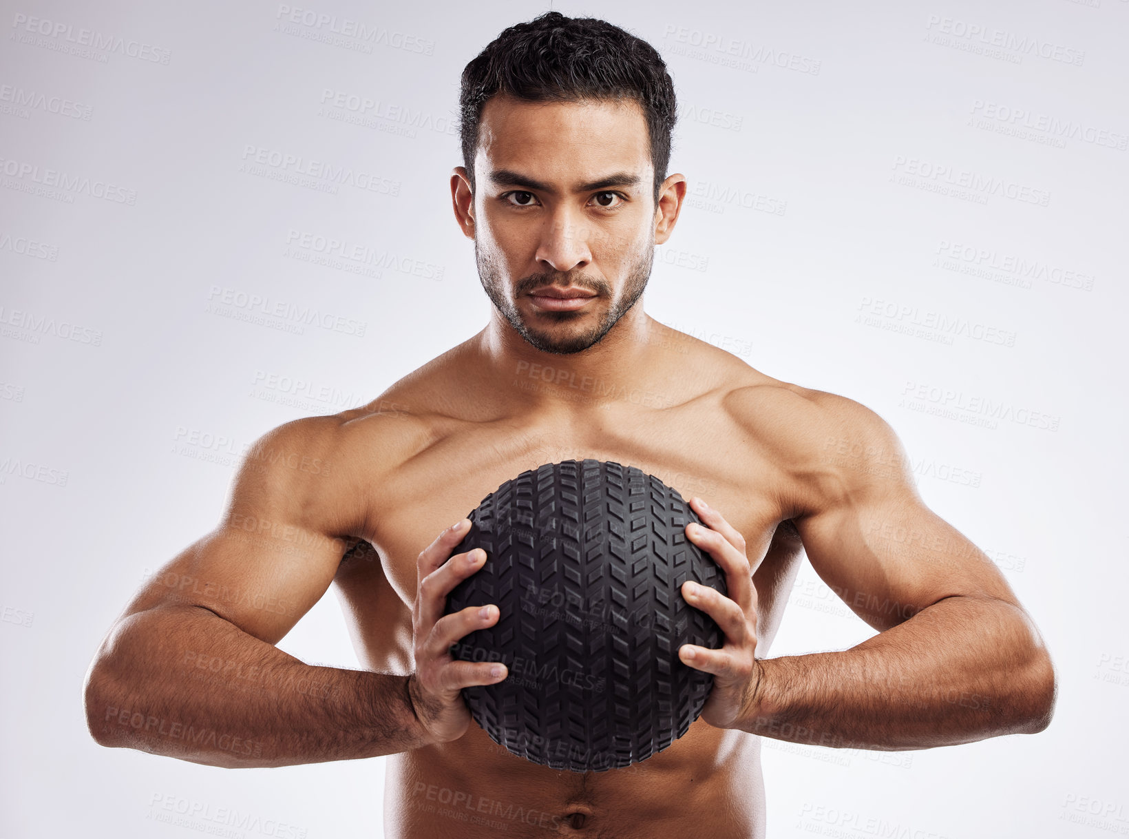 Buy stock photo Portrait, athlete and serious man with medicine ball in studio for body care, wellness and health for muscles. Male person, bodybuilder and workout or training for weight loss by white background