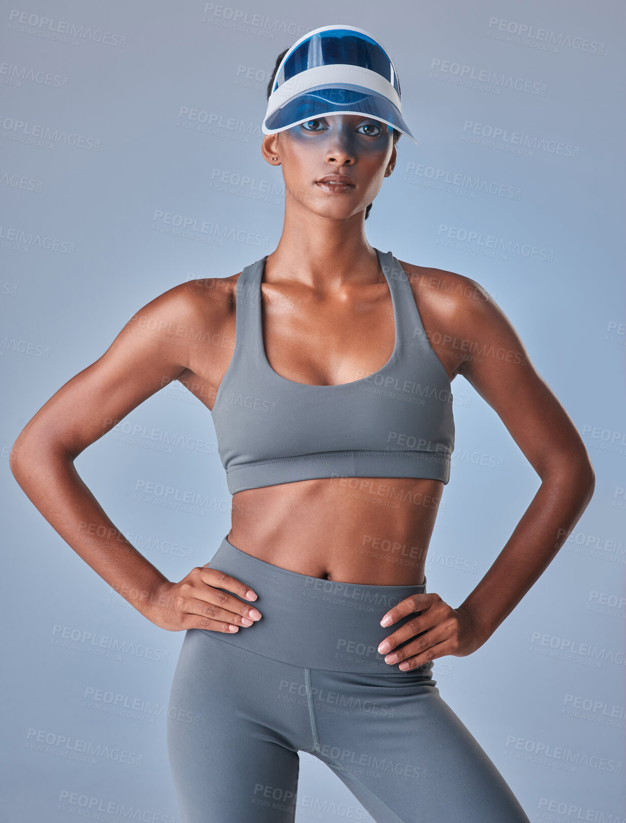 Buy stock photo Studio shot of a fit young woman posing against a grey background