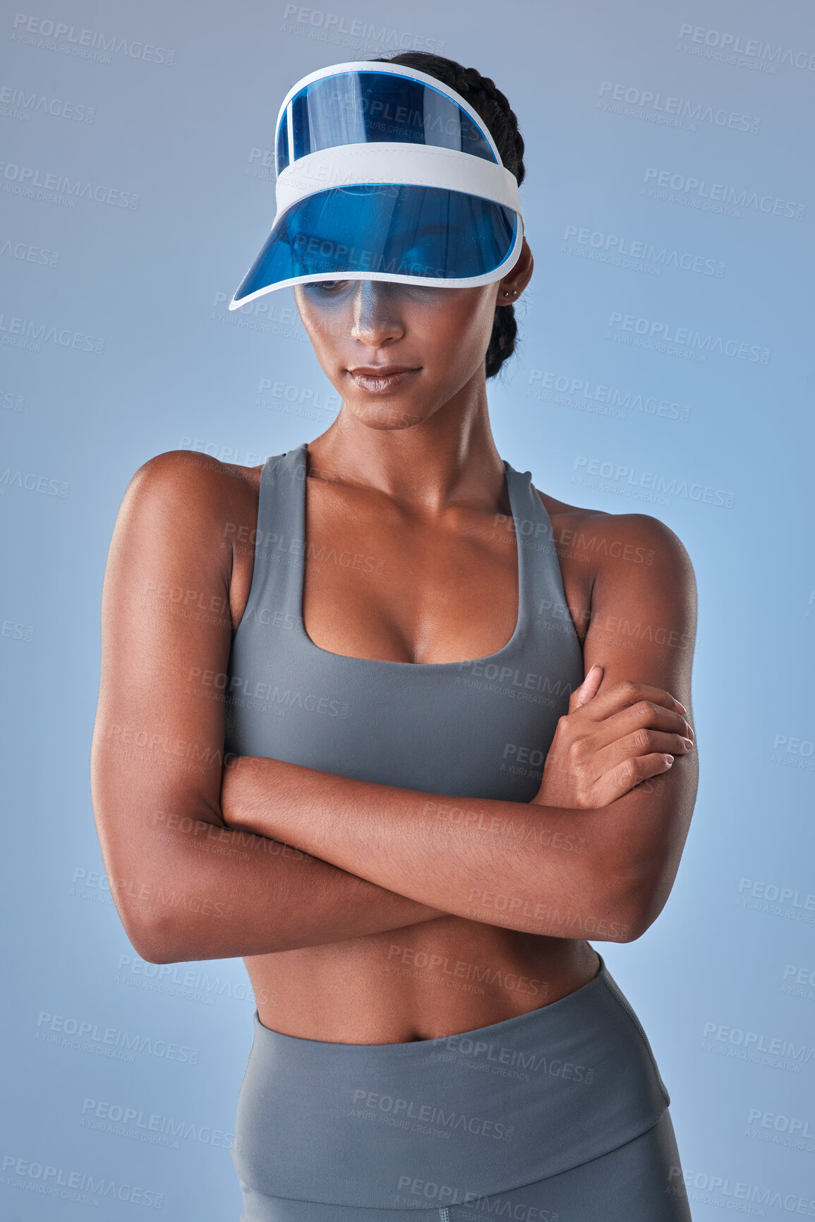 Buy stock photo Studio shot of a fit young woman posing against a grey background