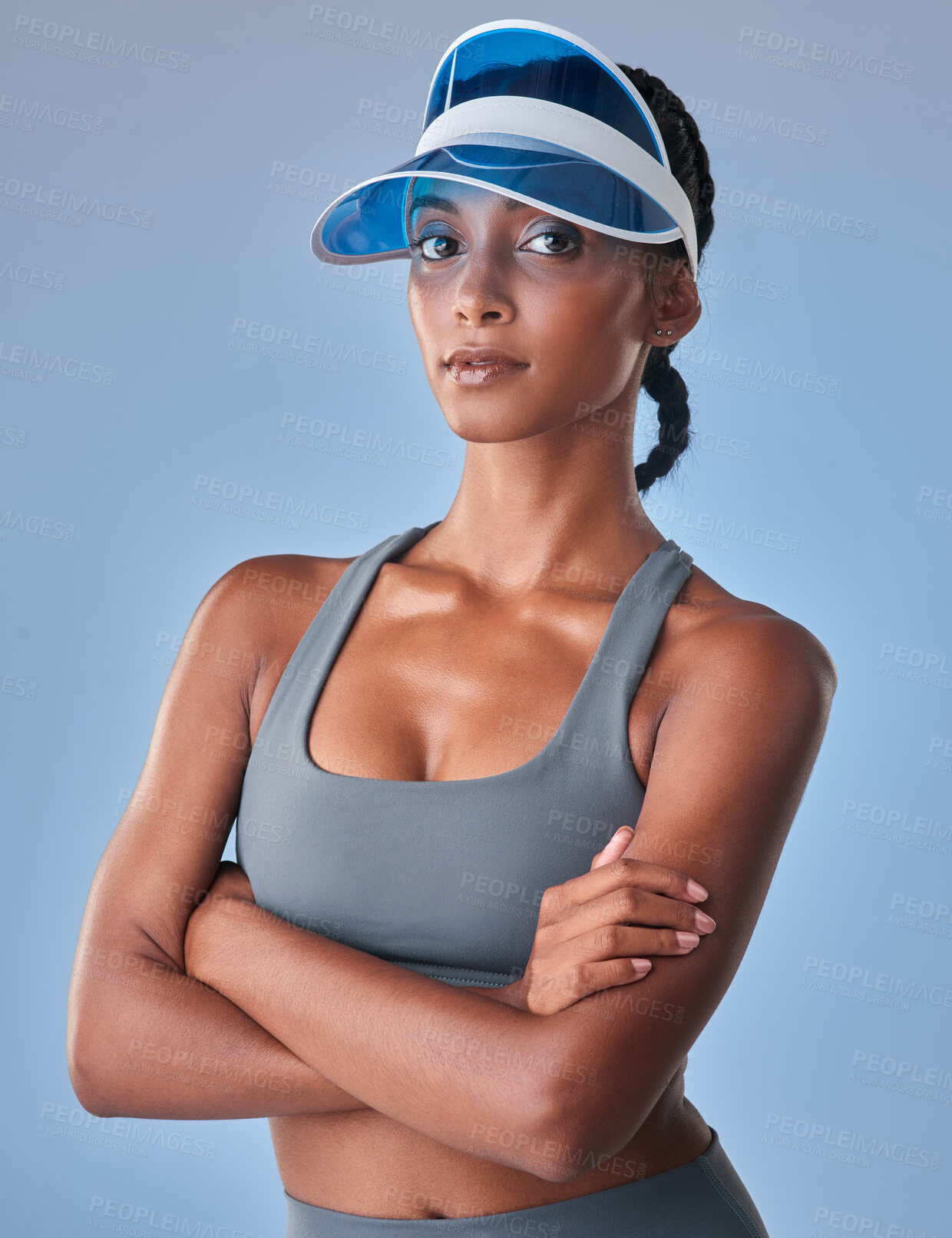 Buy stock photo Studio shot of a fit young woman posing against a grey background