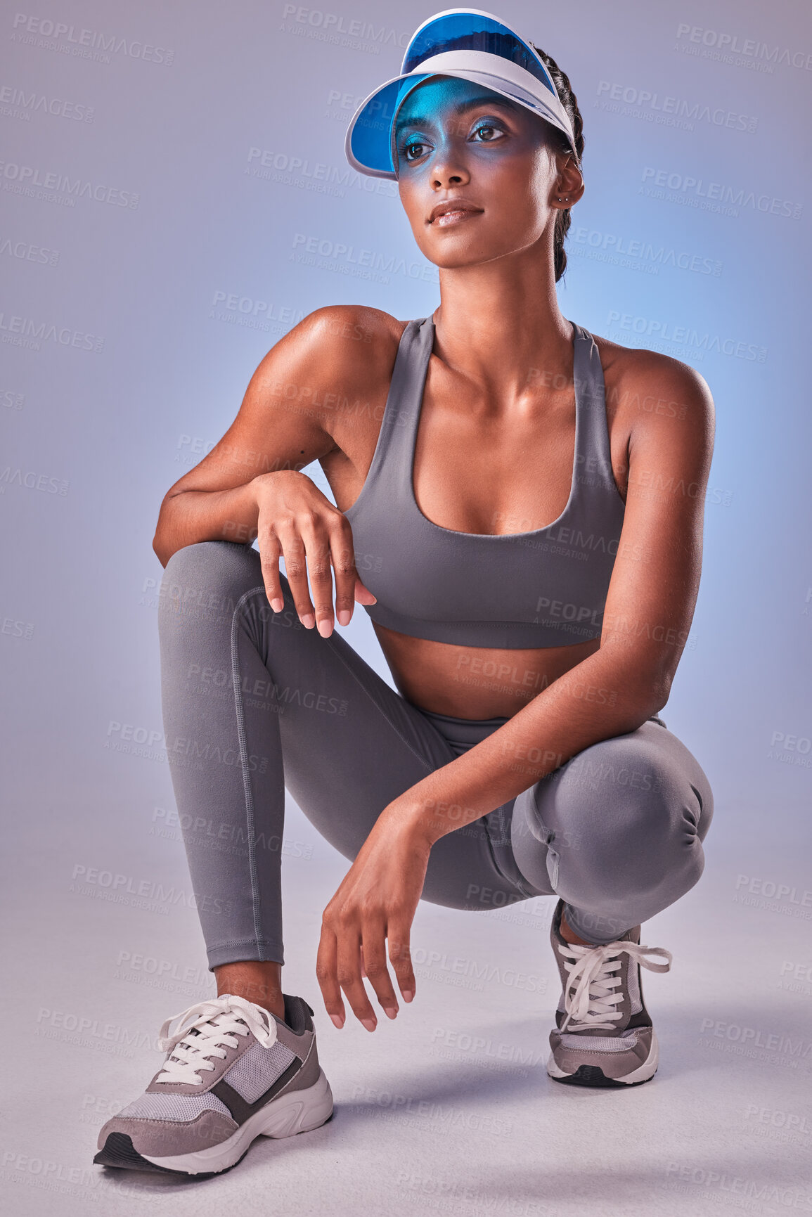 Buy stock photo Studio shot of a fit young woman posing against a grey background