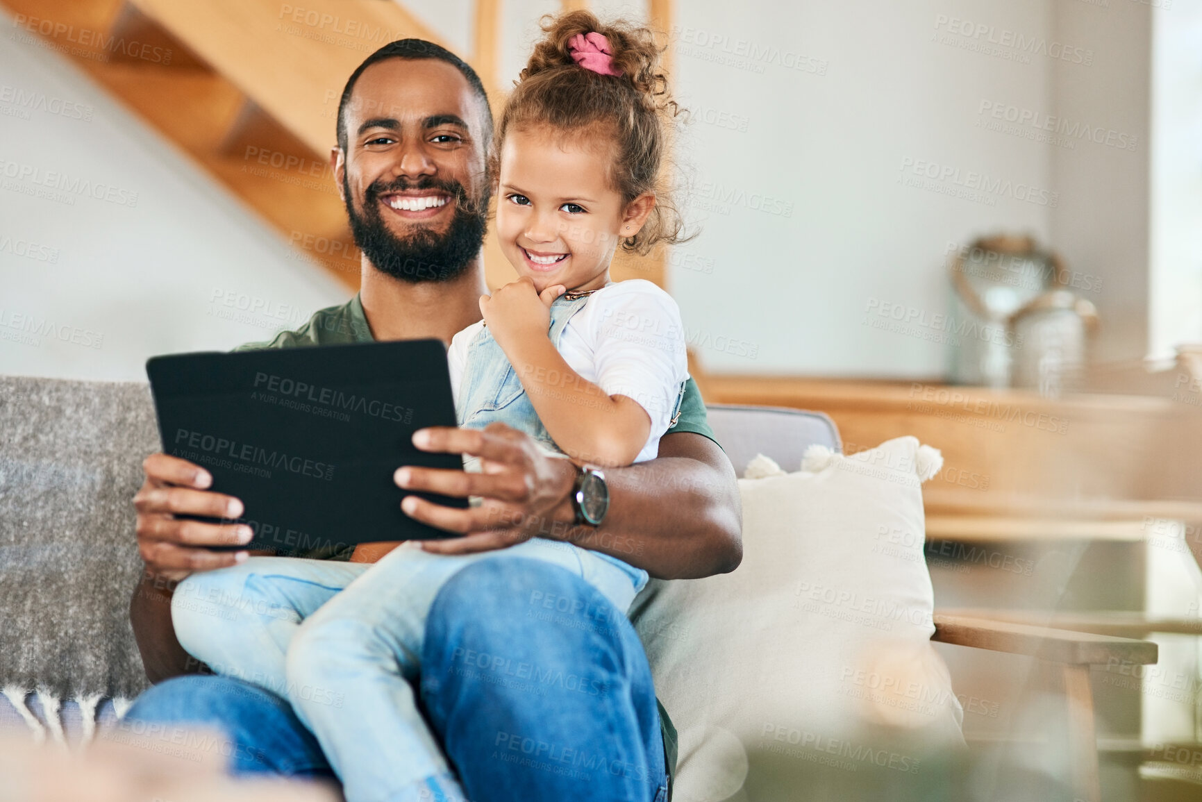 Buy stock photo Portrait of a father and his little daughter using a digital tablet together at home