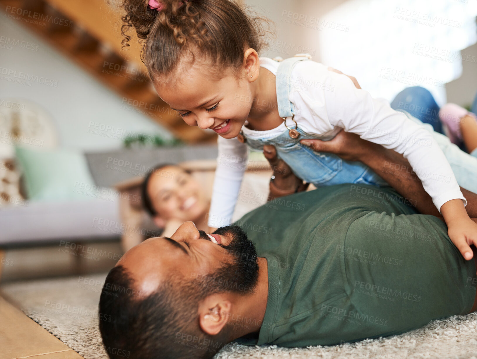 Buy stock photo Shot of a happy family having fun together at home