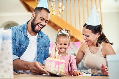 Buy stock photo Shot of a little girl celebrating a birthday with her parents at home