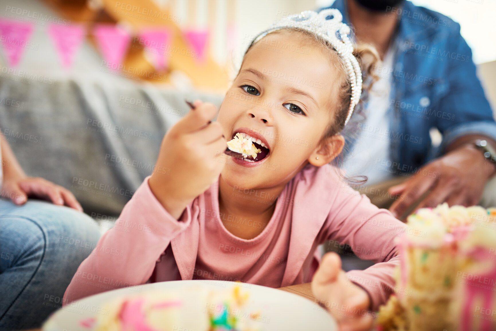 Buy stock photo Shot of a little girl celebrating a birthday with her parents at home