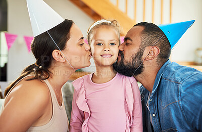 Buy stock photo Shot of a little girl celebrating a birthday with her parents at home