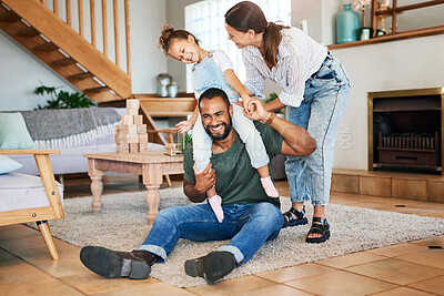 Buy stock photo Shot of a happy family having fun while relaxing together at home