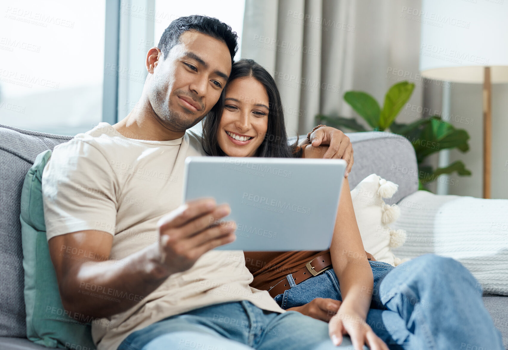 Buy stock photo Happy couple, tablet and watching on sofa for online streaming, entertainment or social media at home. Man and woman smile and sitting in living room for technology, connection or networking at house