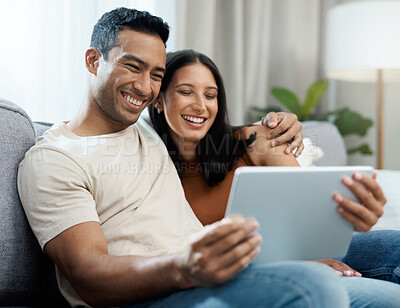 Buy stock photo Happy couple, tablet and relax on sofa for entertainment, online streaming or social media at home. Man and woman sitting in living room with smile for technology, connection or networking at house
