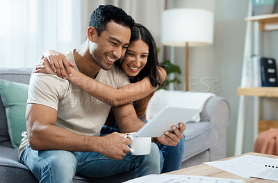 Buy stock photo Happy couple, hug and tablet for social media on sofa in house for funny joke, meme or post. Man, woman and smile in excitement with coffee for article on internet, mobile app and web for relaxing