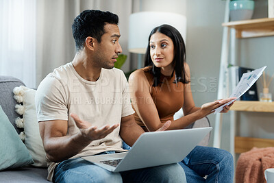 Buy stock photo Frustrated couple, laptop and documents in financial crisis, debt or argument on living room sofa at home. Man and woman with computer and paperwork in disagreement for expenses or bills at house