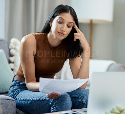 Buy stock photo Frustrated woman, documents and headache for debt, stress or mistake in burnout on living room sofa at home. Female person with paperwork or migraine in anxiety for financial crisis or bills at house