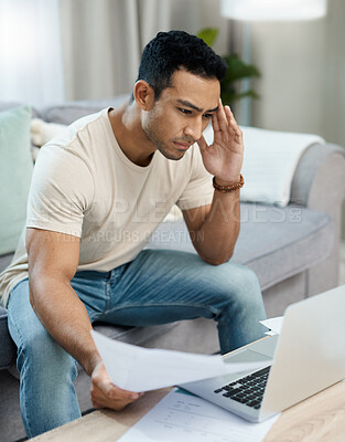 Buy stock photo Man, bills and headache on laptop and sofa for finance mistake, debt review or taxes stress at home. Young and confused person with documents for budget fail, bankruptcy or inflation news on computer