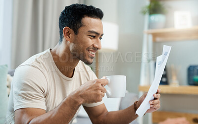 Buy stock photo Home, bills and happy man with coffee for planning, reading financial documents and taxes management in living room. Young person with tea and paperwork for mortgage, budget and insurance or finance