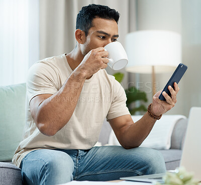Buy stock photo Man, phone and reading with coffee on sofa in home for taste of hot beverage. Asian person, technology and mobile app for message, internet or social media by cellular with drink to relax living room