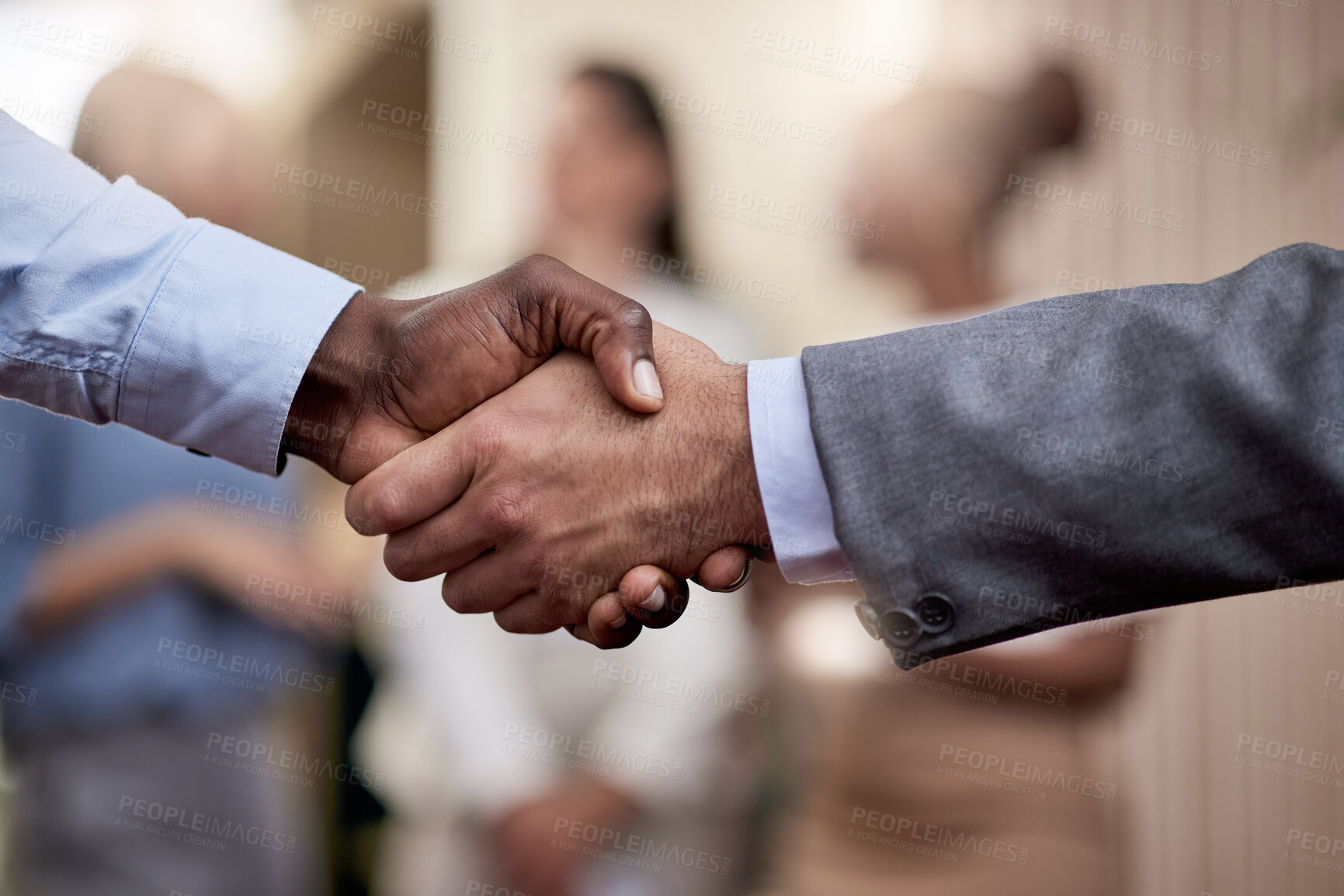 Buy stock photo Shot of two businessmen shaking hands in greeting