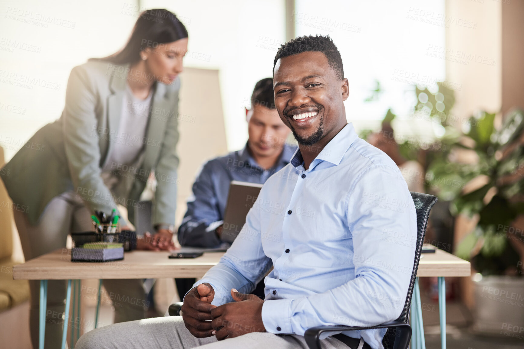 Buy stock photo Shot of a young businessman in his office