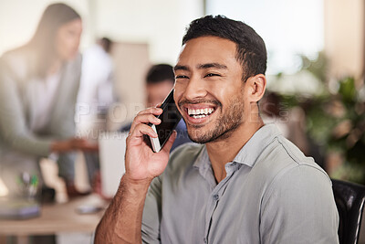 Buy stock photo Shot of a handsome young businessman using his smartphone to make a call