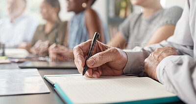 Buy stock photo Shot of an unrecognizable businessperson writing in a notebook at work