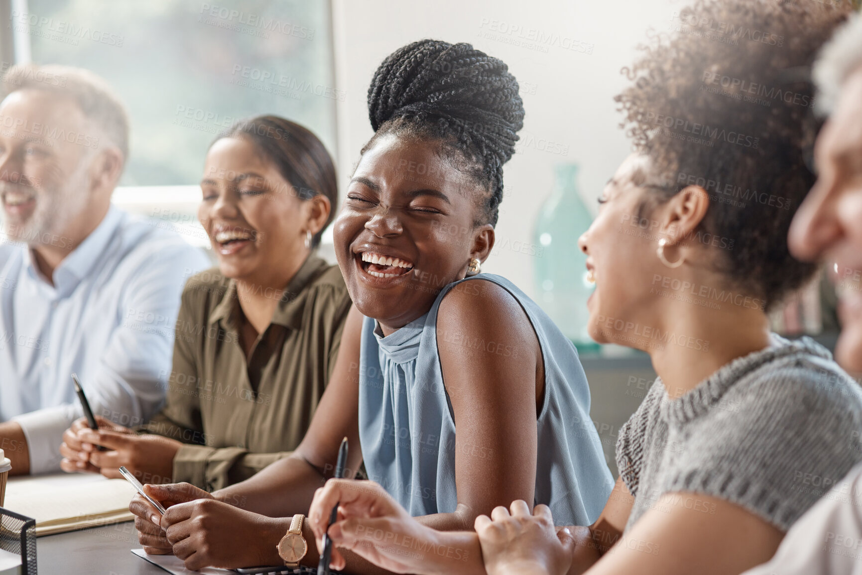 Buy stock photo Shot of a group of businesspeople in a meeting at work