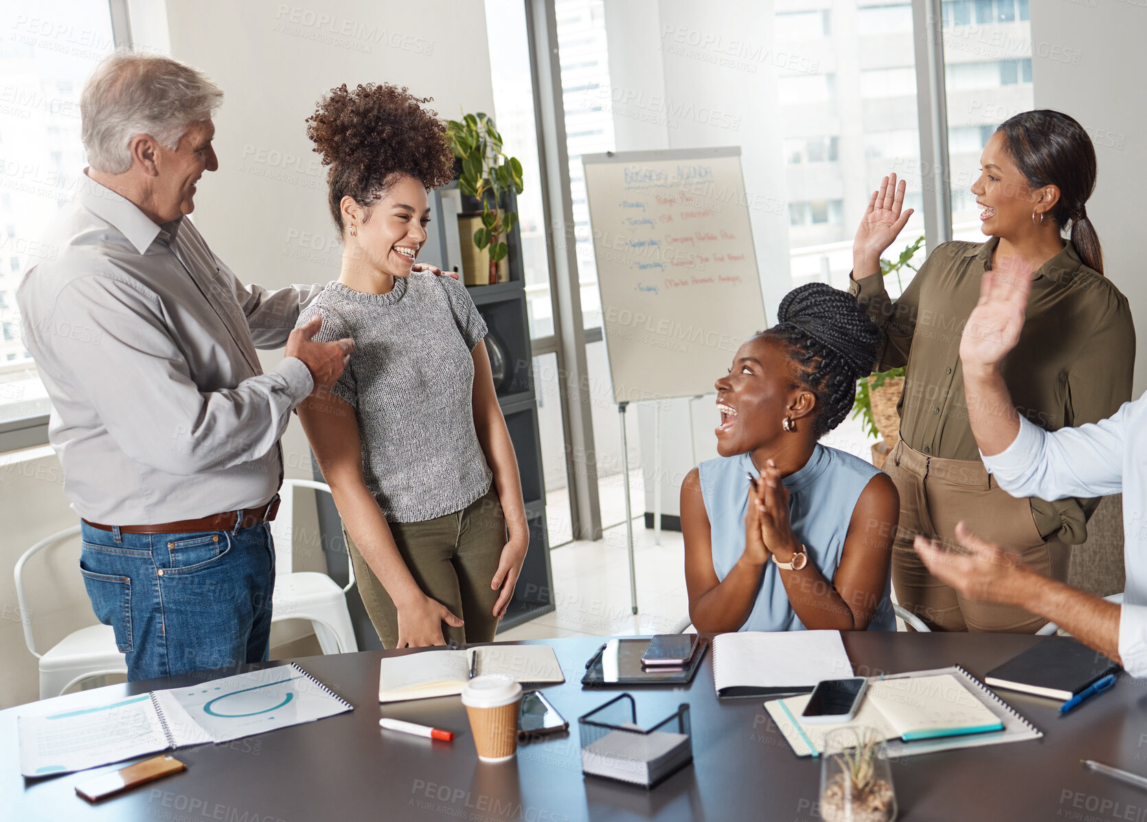 Buy stock photo Shot of a group of businesspeople clapping hands in a boardroom at work