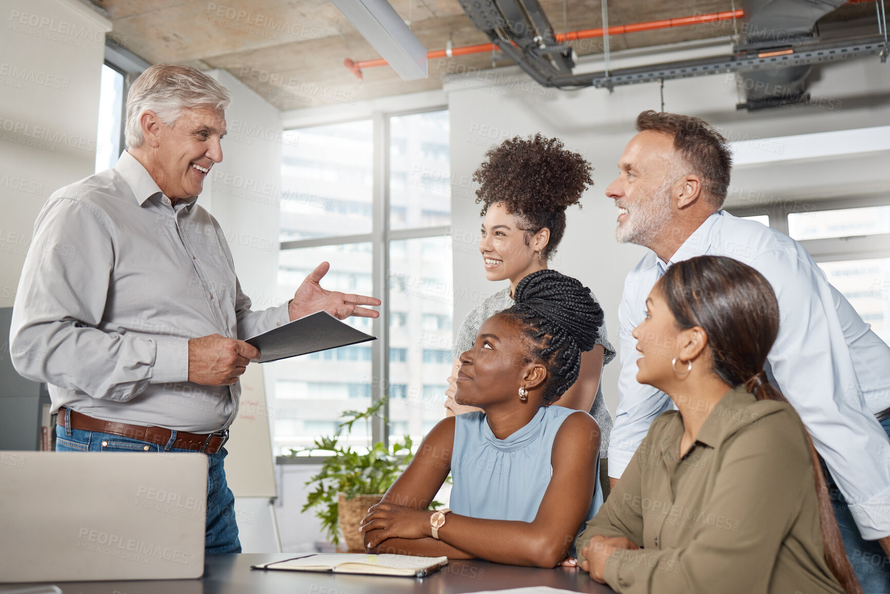 Buy stock photo Shot of a group of businesspeople in a meeting at work