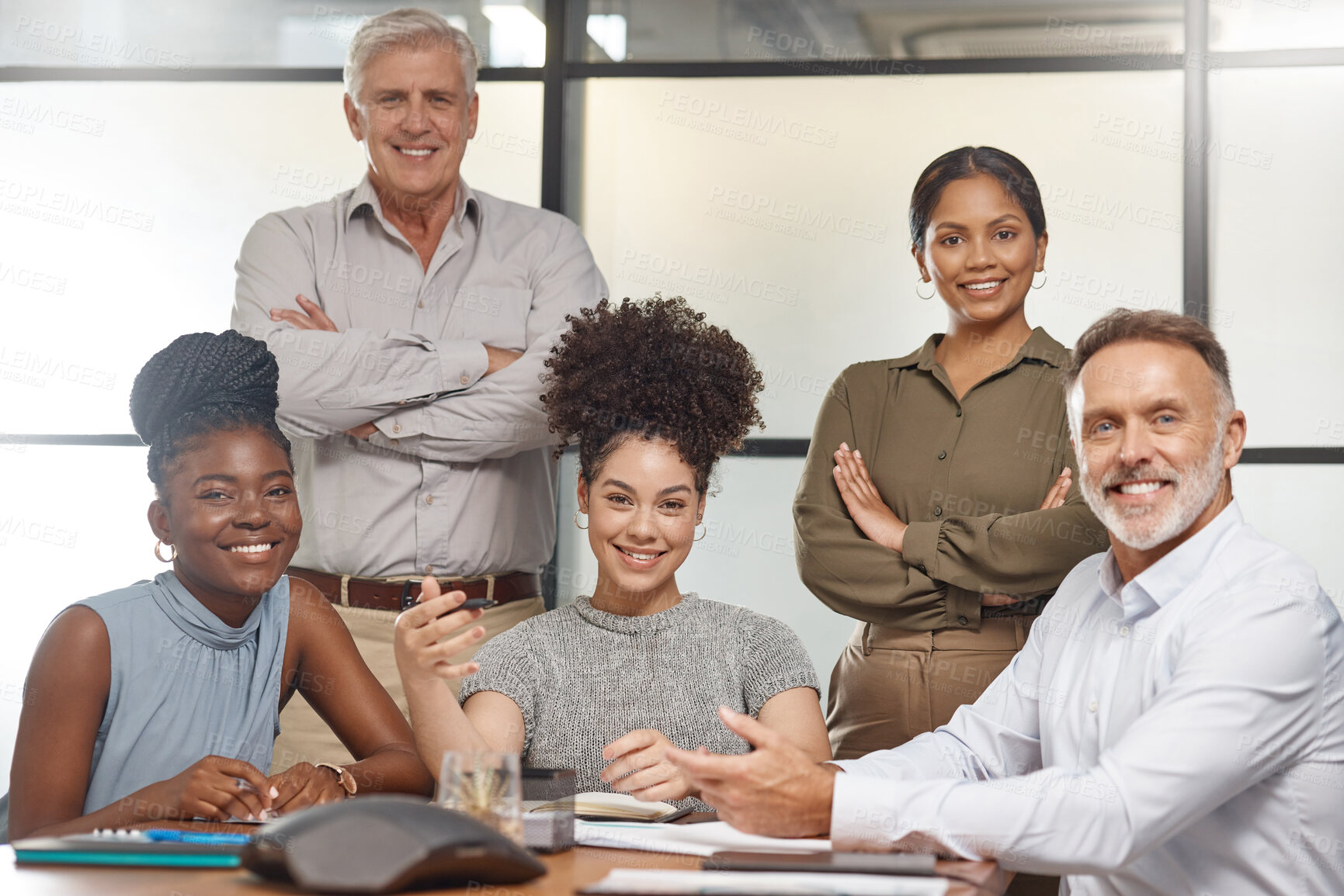 Buy stock photo Shot of a group of businesspeople in a meeting at work