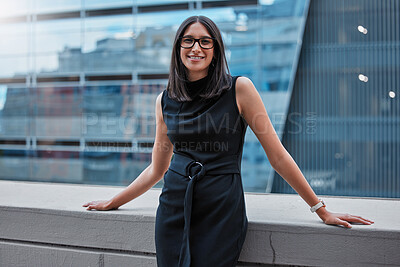 Buy stock photo Cropped portrait of an attractive young businesswoman standing outside on the office balcony