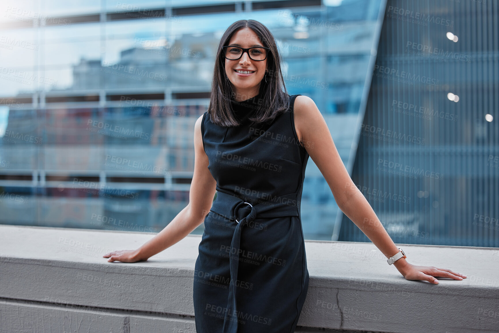 Buy stock photo Cropped portrait of an attractive young businesswoman standing outside on the office balcony