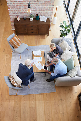 Buy stock photo Aerial shot of a group of businesspeople going through paperwork
