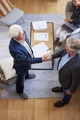 Buy stock photo Aerial shot of two senior businessmen shaking hands