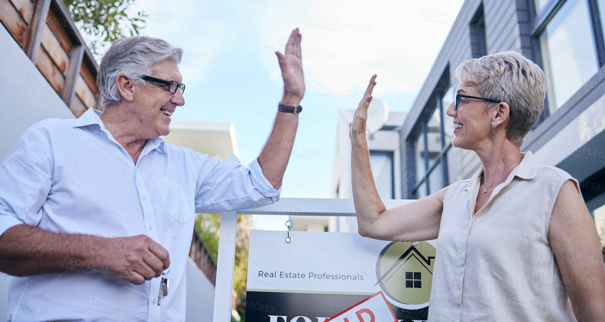 Buy stock photo Mature couple, house sold and outdoor high five with smile for congratulations, property sale and buying home. Happy, people or realtors on real estate for deal, move and relocation or investment