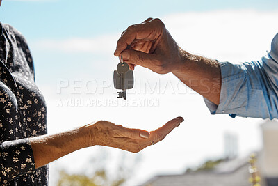 Buy stock photo Shot of an unrecognizable realtor giving the keys to a house to a buyer