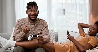 Buy stock photo Black man, home and happy on sofa for video game with playing, fun and excited with winning. Couple, relationship and relax on couch in living room with smile together for victory and celebration