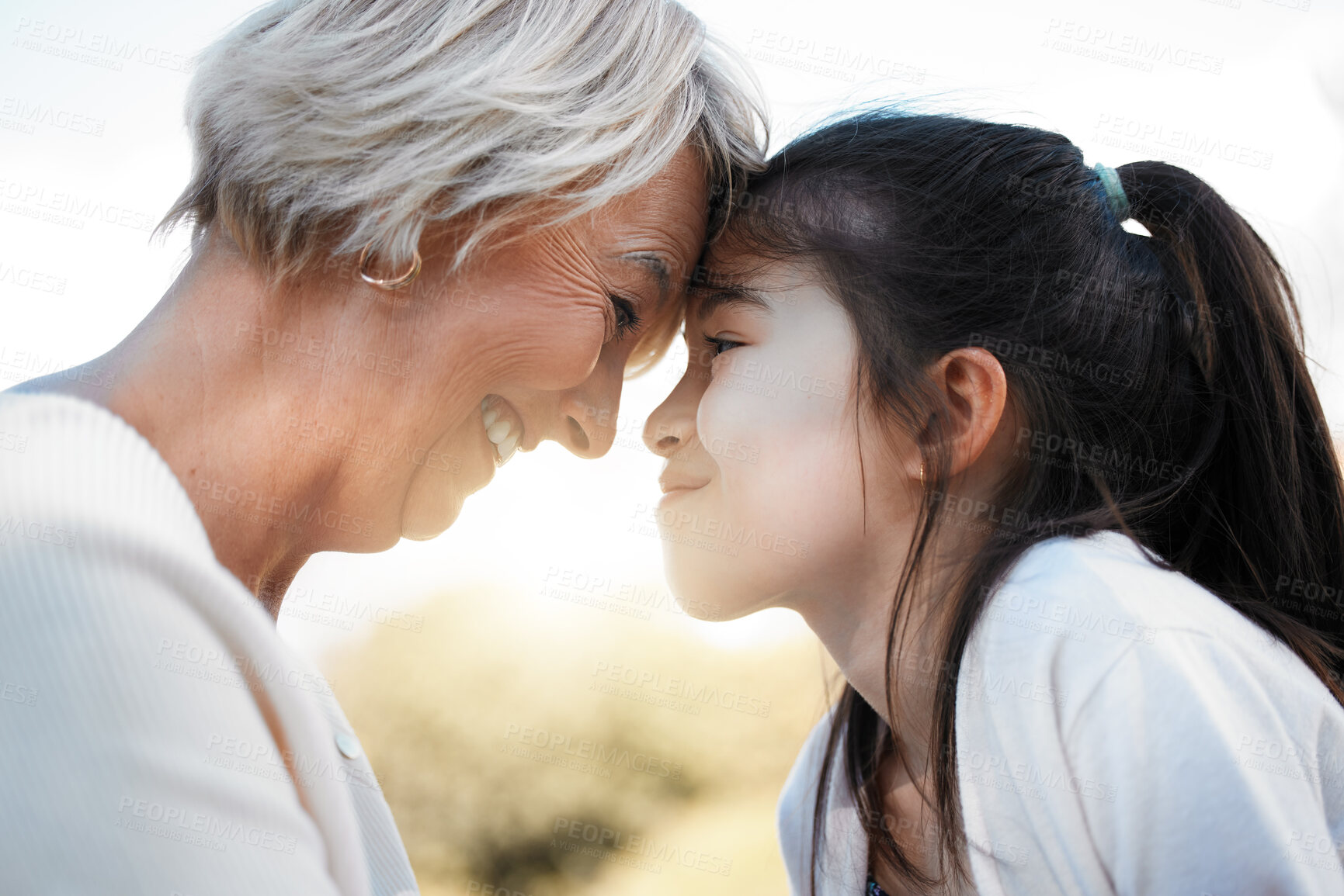 Buy stock photo Grandmother, girl and close with happiness in nature with love in outdoor with family and sun. Kid, grandma and noses with smile and loving in the garden with bonding together on the weekend for joy.