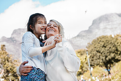 Buy stock photo Grandma, girl and happy outdoor for playing with hug for bonding, support and care on child development. People, adoption and smile in park for memories, fun and growth as family on holiday in London