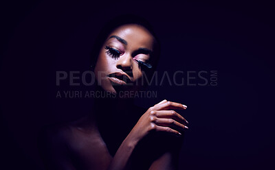 Buy stock photo Studio shot of a young woman posing against a black background black background