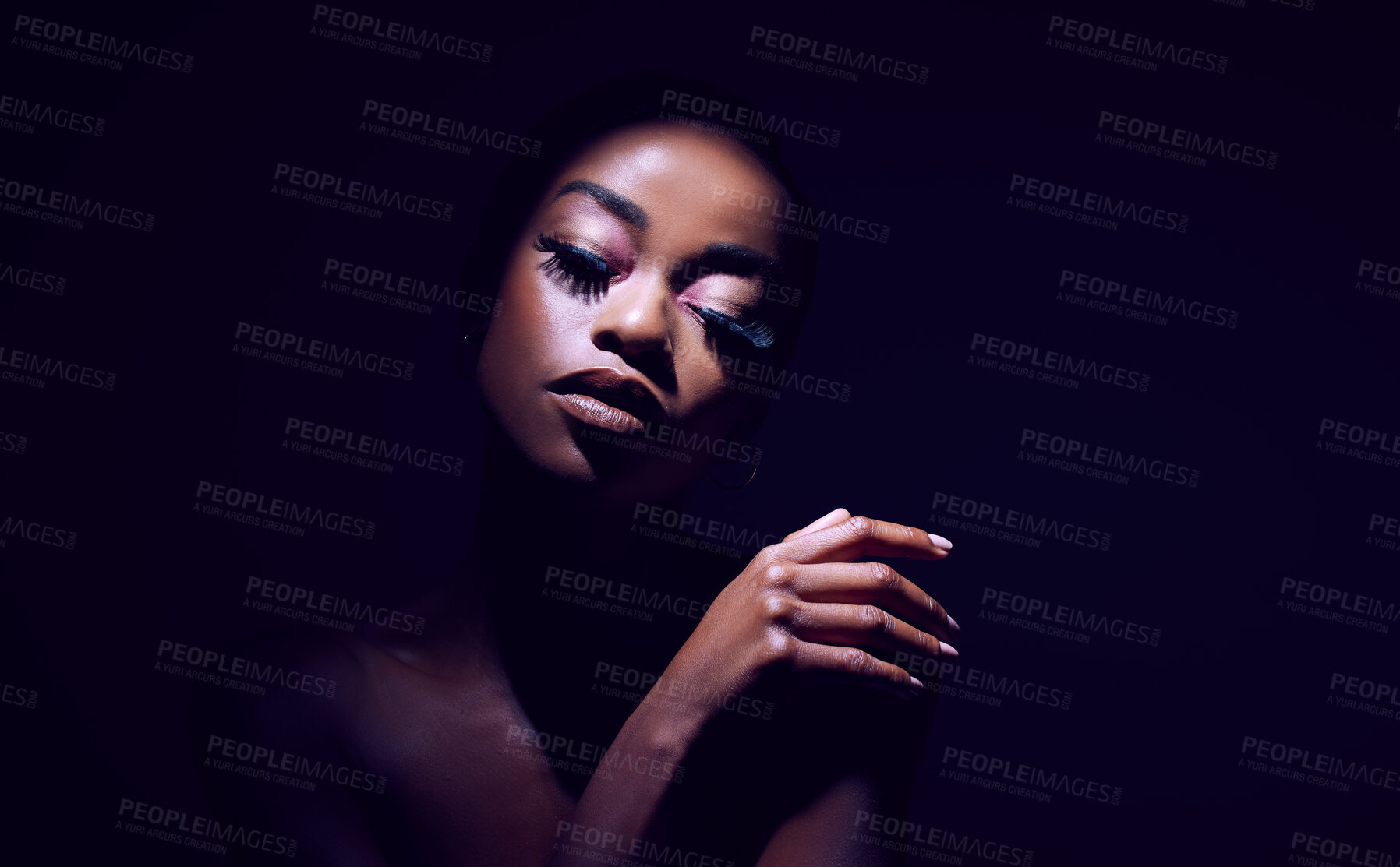 Buy stock photo Studio shot of a young woman posing against a black background black background