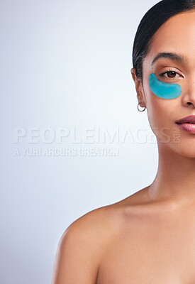 Buy stock photo Woman, half face and eye patch in studio, facial treatment and hydration mask on white background. Female person, skincare and beauty product for moisture, mockup space and pad to pamper or cosmetics