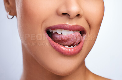 Buy stock photo Cropped shot of an unrecognizable woman showing off her healthy mouth while licking her tongue
