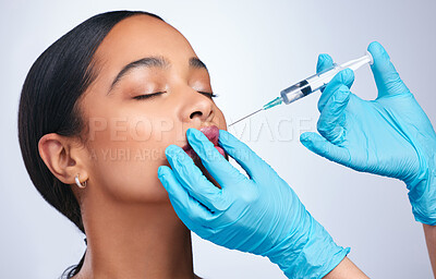 Buy stock photo Woman, studio and needle for lips, surgery and cosmetics for skin, facial or collagen by white background. Girl cosmetic surgeon and filler on face, syringe and hands for beauty, skincare and mouth